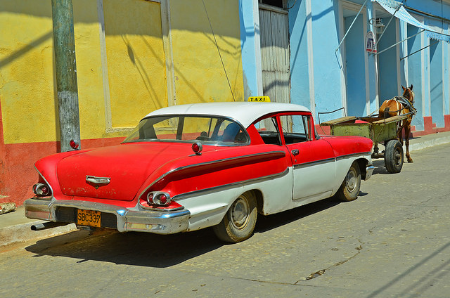 Some typical modes of travel on the streets of Trinidad, Cuba. Many in the US, including some businesses, are calling for the lifting of travel and trade restrictions between the US and Cuba. Image credit: Views from the Street in Cuba, Bud Ellison licensed by Creative Commons via flickr.